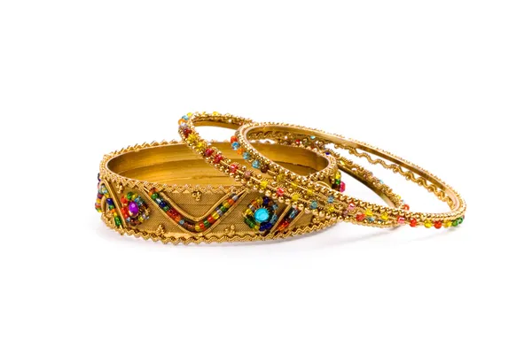 Three golden bracelets — Stock Photo, Image