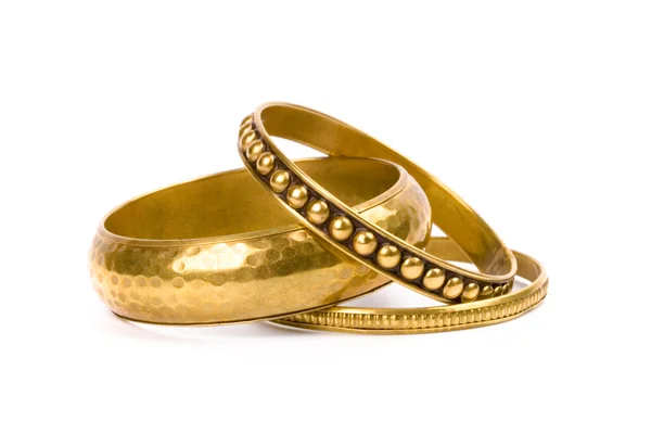 Drei goldene Armbänder — Stockfoto