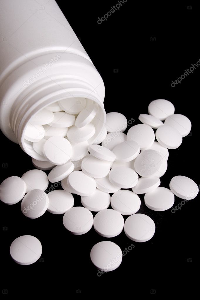 Bottle with white pills