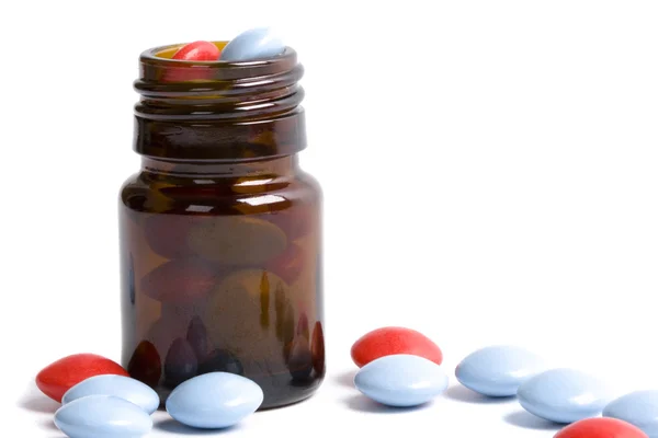 Bottle with red and blue pills — Stock Photo, Image