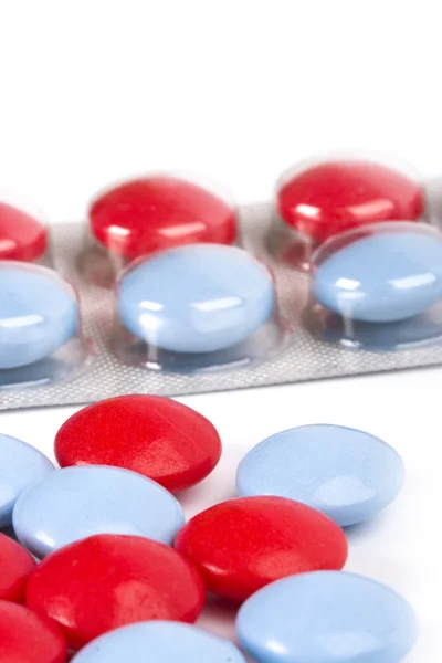Comprimidos vermelhos e azuis — Fotografia de Stock
