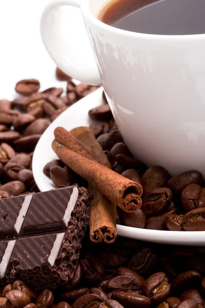 Cup of coffee, beans, cinnamon and black — Stock Photo, Image