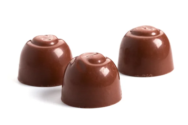 Tre choklad godis — Stockfoto