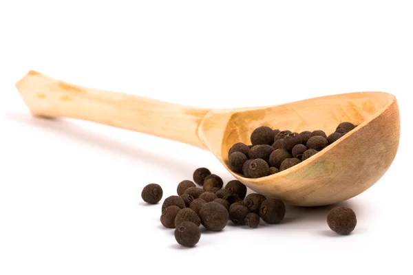 Pepper on wooden spoon — Stock Photo, Image