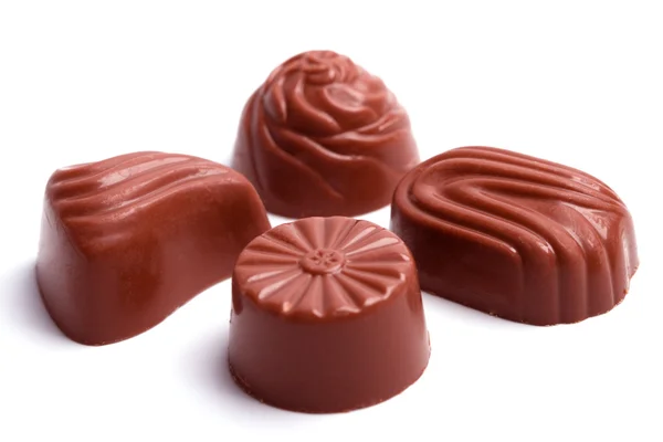 Четыре шоколадных конфеты — стоковое фото