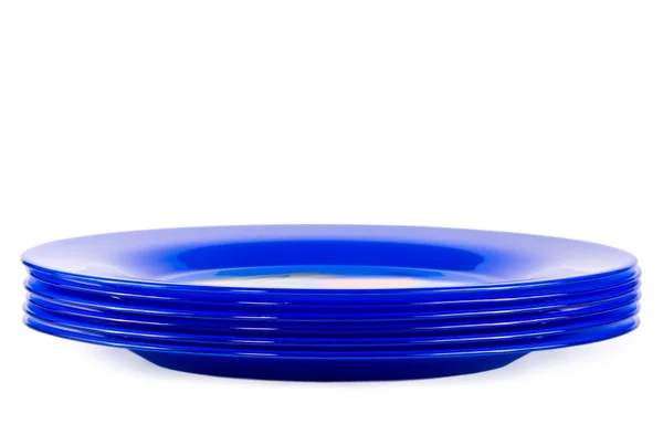 Sei piatti blu scuro su un bianco — Foto Stock