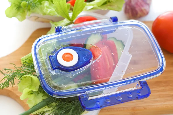 stock image Salad from vegetables in the container.