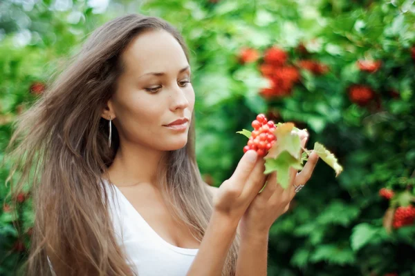 Beautiful girl with guelder rose — Stock Photo, Image