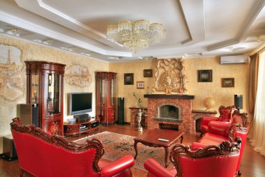 Drawing-room in golden and red colors