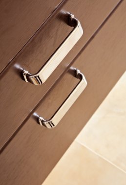 Brown hardwood drawers with metal handle clipart