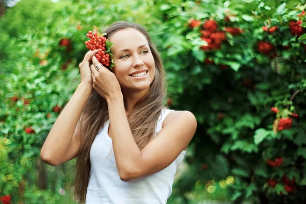 Beautiful woman with guelder rose — Stock Photo, Image