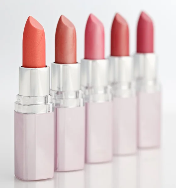 Color lipsticks arranged in line — Stock Photo, Image