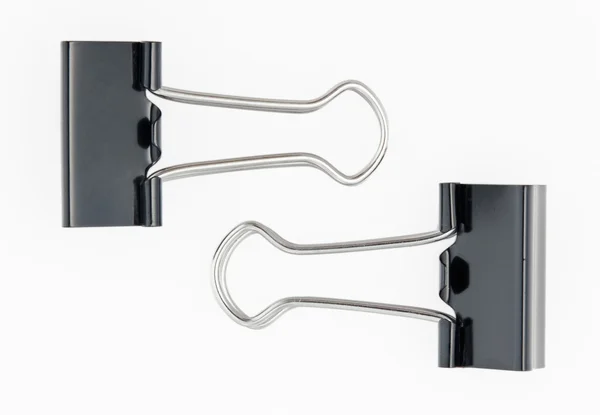 Two black metal paper clips on white — Stock Photo, Image