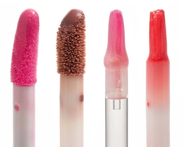 Four color gloss lipstick Brushes — Stock Photo, Image