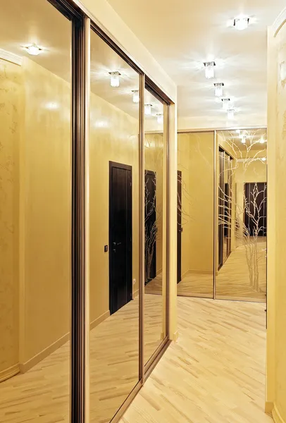 Passage with a mirror wardrobe in warm — Stock Photo, Image