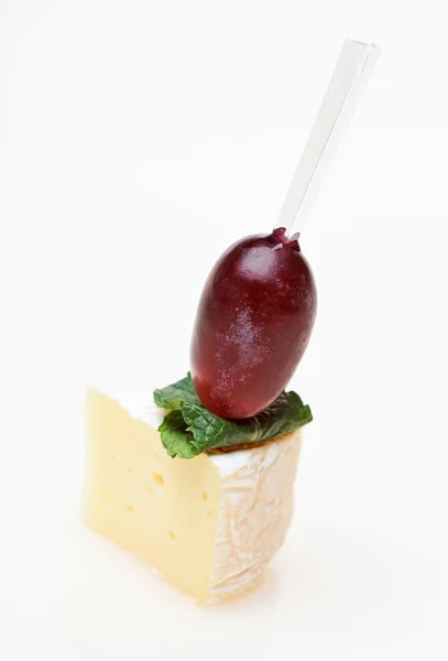 stock image Cheese canape with grape and mint