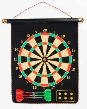 Darts set on a black sheet board clipart