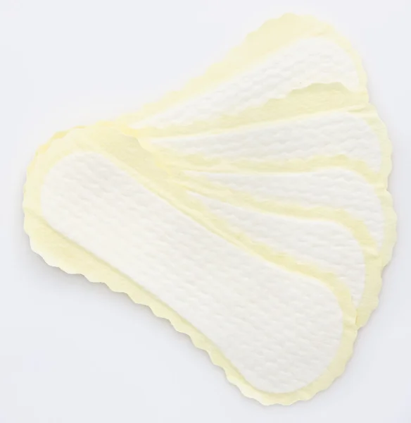 与淡黄色的环绕式卫生巾 — 图库照片