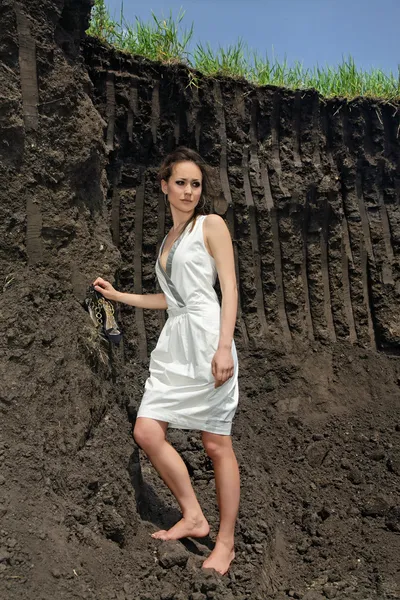 Lady in white sundress in ground quarry — Stock Photo, Image