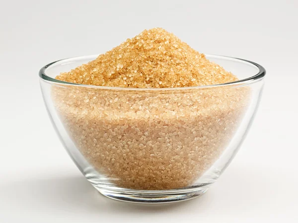 Cane sugar in a glass bowl — Stock Photo, Image