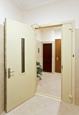 Modern hall interior with open door clipart