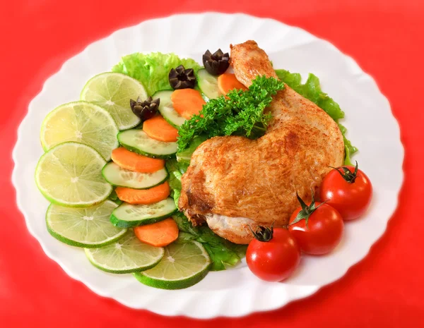 Fried chicken leg on a plate — Stock Photo, Image