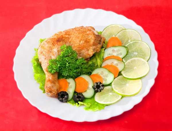 Fried chicken leg on a plate — Stock Photo, Image