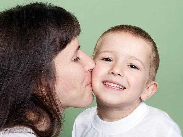 Mother kissing child — Stock Photo, Image