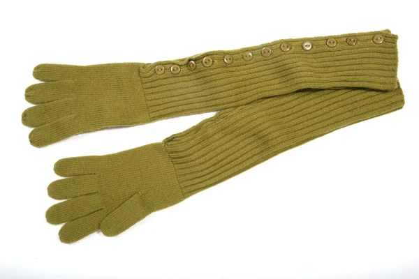 Зеленые вязаные перчатки — стоковое фото