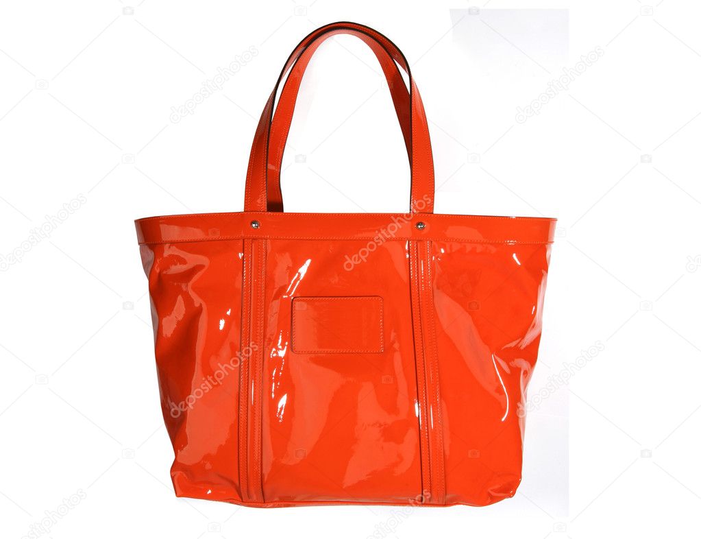 Orange leather bag isolated on white