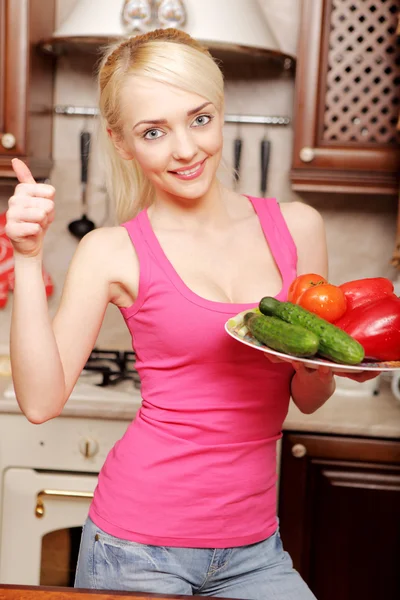 Young woman in the kitchen — Stock Photo, Image