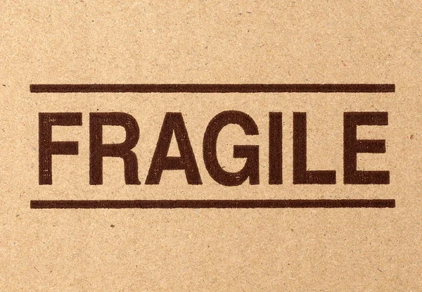 Simbolo fragile su cartone — Foto Stock