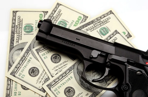 Pistola e dólar — Fotografia de Stock