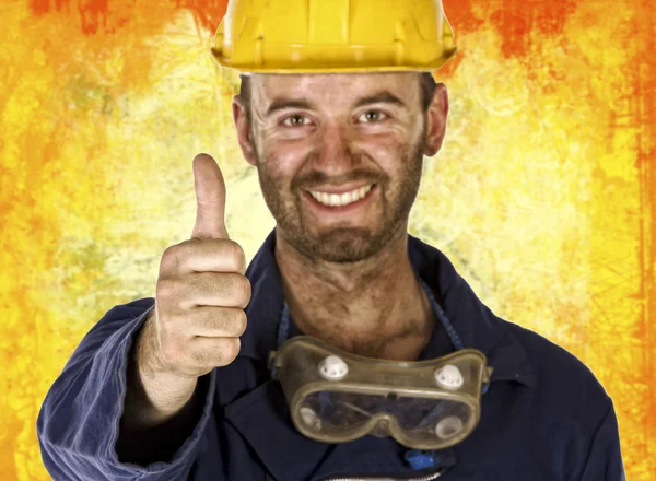 Confident labourer thumn up — Stockfoto