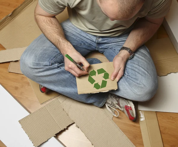 Caucasian man and recycling paper — стокове фото