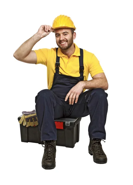 Handyman sentar em sua caixa de ferramentas — Fotografia de Stock