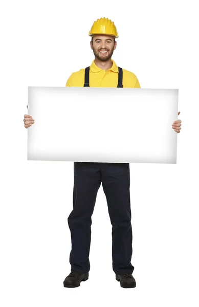 Handyman segurar placa branca — Fotografia de Stock
