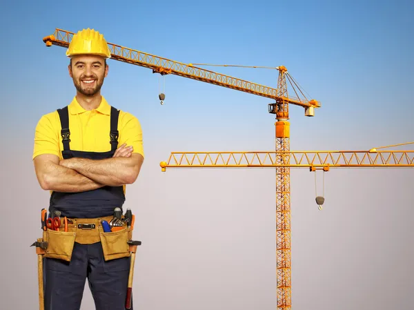 Handyman and construction metal crane — Stock Photo, Image