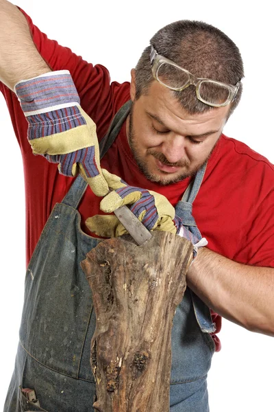 Man sculptor and his wood — Stock Photo, Image