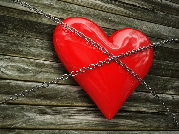Corazón rojo y cadena metálica —  Fotos de Stock