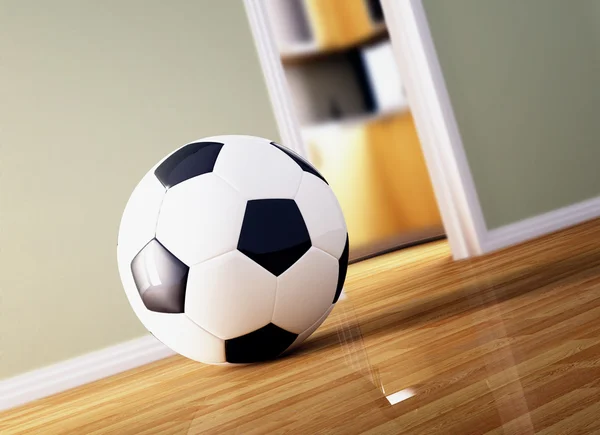 Bola de futebol no chão de madeira — Fotografia de Stock