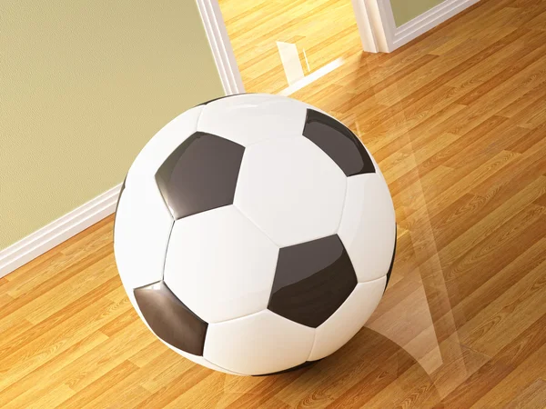 Футбольный мяч на деревянном полу — стоковое фото
