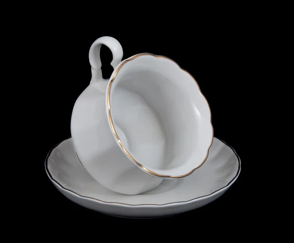 Filiżanka herbaty z talerzykiem na czarny — Zdjęcie stockowe