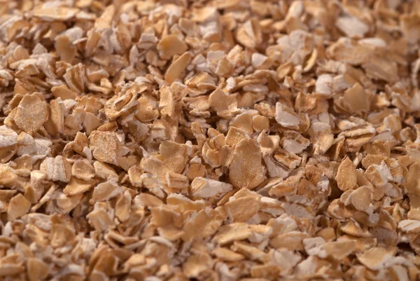 Crushed oatmeal background — Stock Photo, Image