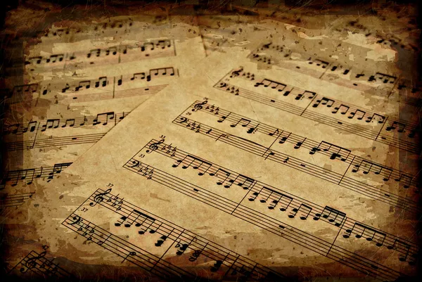 Notas musicales sobre pergamino —  Fotos de Stock