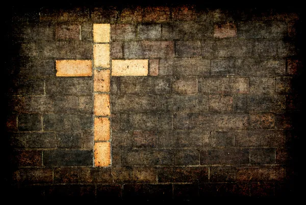 Kruis van Christus ingebouwd in een bakstenen muur — Stockfoto
