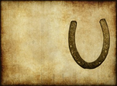 Old horseshoe on paper or parchment clipart