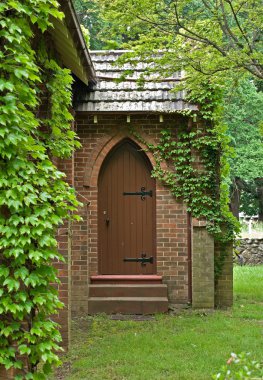 Vine covered church building clipart