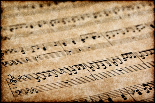 Notas musicales sobre pergamino — Foto de Stock