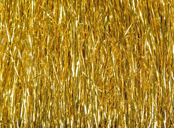 Golden tinsel texture — Stock Photo, Image